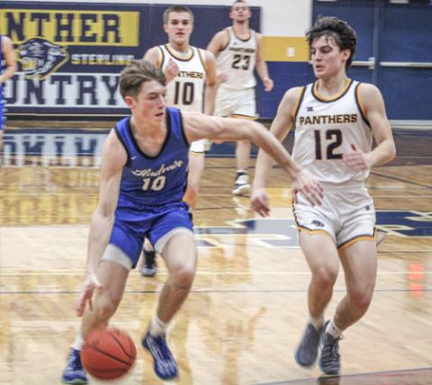 Gladwin’s Seth Mead tries to force his way to the basket during Friday night’s district final loss at Standish.
