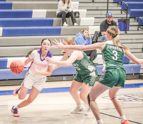 Gladwin’s Liliana Gutierrez drives the baseline during last week’s loss to visiting Pinconning on Coaches Vs. Cancer Night.