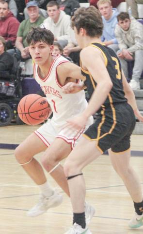Beaverton’s Sean Barta slams on the brakes and checks his options during last week’s district semifinal victory over Evart at Farwell.