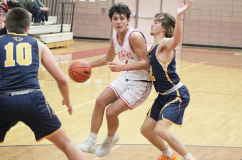 Beaverton’s Sean Barta tries to slip between two Standish defenders during Friday night’s loss to the Panthers. SCOTT SALOWICH