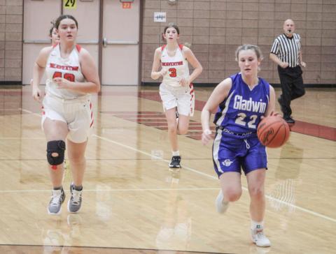 Gladwin’s Elizabeth Winchester runs the floor during the Flying G’s junior varsity victory Thursday night.