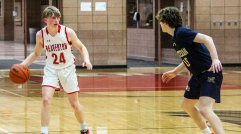 Senior George Killian takes the ball pass midcourt and into opponent territory.