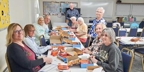 MARSP-Gladwin County Chapter volunteers participate in a work-bee to prepare candy bars to distribute in appreciation to Gladwin and Beaverton School staff.