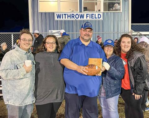 Pastor Withrow and his family on the newly named Withrow Field.