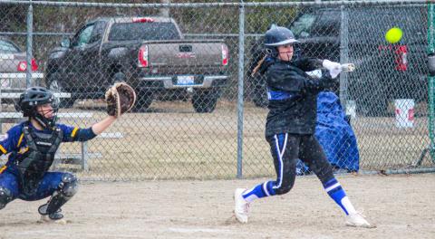 Gladwin batters continue knocking the ball during Tuesday’s rainy hail.