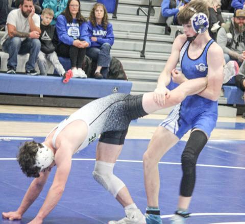 Gladwin’s Ethan Palmateer locks up a leg during Thursday’s team district tournament. Palmateer went on to win an individual district championship Saturday.