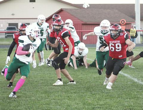 Beaverton’s Sean Doyle chases down a Pinconning running back during Friday night’s Homecoming victory over the Spartans.