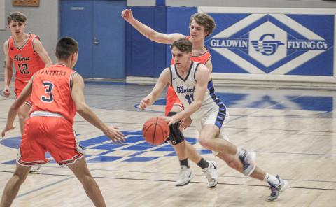 Gladwin’s Trace Corlew cuts through the Alma defense during Friday night’s overtime loss to the Panthers in the final game of the regular season.