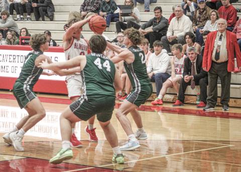 Beaverton’s Caiden Loar runs into a brick wall of Pinconning defenders during Thursday night’s game.