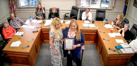 Mayor Sarah Kile (right) presented a proclamation to Lisa Kujawa (left) of Golden Key Camp at a Gladwin City Council meeting on Monday, October 21. YOUTUBE: CITY OF GLADWIN