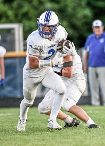 Gladwin’s MJ McDonald looks for running room. MINDY STOKOSZYNSKI