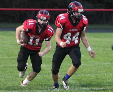 Beaverton junior varsity running back Caden Snyder follows blocker Ben Zdrojewski during a recent game. The Beavers finished the season with a comeback victory over Morley Stanwood.