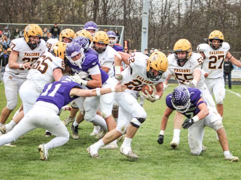 Ogemaw Heights’ Connor Lambert grinds out some tough yardage during Saturday’s victory at Saginaw Swan Valley that sent the Falcons into the Final Four in Division 5.