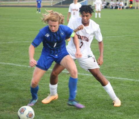 Gladwin’s Treyton Siegert battles for control of the ball during last Wednesday’s 6-2 victory over Cheboygan.