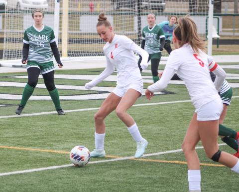 Beaverton’s Trinity Danielak gets control of the ball in front of Clare’s net during last week’s season-opener.