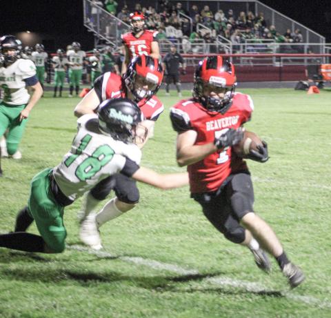 Beaverton’s Karter Offenbecker makes a cut up the field during Friday night’s victory over Houghton Lake.