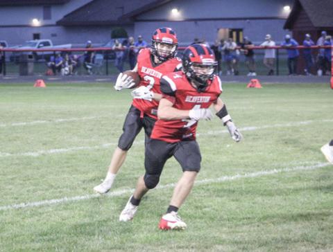 Jack Blades runs behind blocker Ty Wicke during a Beaverton junior varsity game earlier this season.
