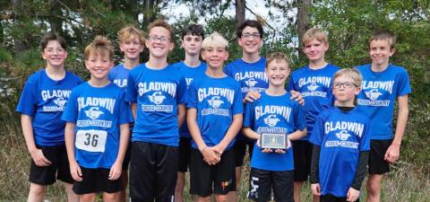 The Gladwin Junior High Boys Cross Country Team ran their way to a second place overall finish in Mt. Pleasant on Oct. 11. They are pictured here after their meet with their plaque. There were 137 runners and nine teams in the race.