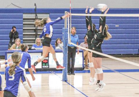 Gladwin’s Kamya Cajigas rips a kill through the defense during last Monday’s three-set victory over St. Louis.