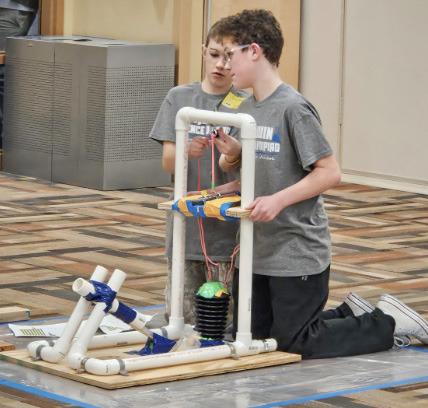 Jericho Barz and Brennan Smith discussing their strategy for hitting the target in Air Trajectory.