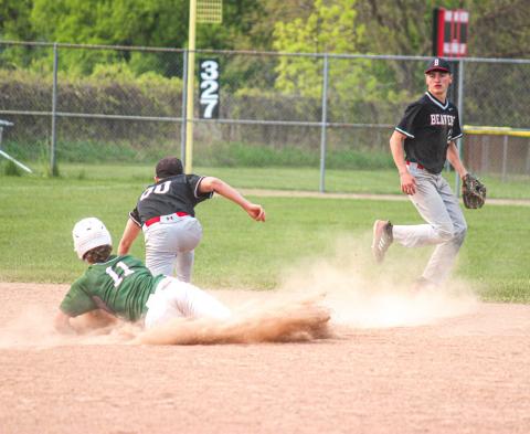 Beaverton shortstop Reese Longstreth backs up second baseman Caiden Loar as Clare tries to steal second base.