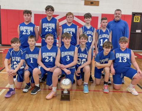 Pictured in back row, left to right: Rhylan Overton (23), Bentley Grice (22), Chris Van-Y (31), Remmy Hartley (10), Laine Hart (14), Coach Bryan Randle. Front row, left to right: Oakley Corradini (22), Cole Lockwood (1), Blake Verellen (24), Preston Newman (30), Keaton Mausolf (30), Tyler Mullins (21), and Bryce Mc-Cummings (13).