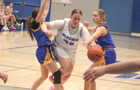 Gladwin’s Lela Gee powers through the defense during last week’s victory over visiting Carson City Crystal.