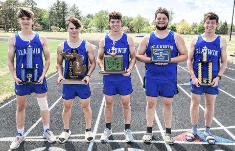 State qualifying boys standing tall with the trophies they’ve collected throughout the season. From left to right Erik Roggow, Earl Esiline, Nick Wheeler, Logan Klein, Caleb Palmreuter.