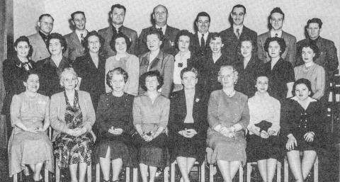 Pictured in bottom row: Harriet Martin, Flossie Cady, Mary Stockton, Helen Woodby, Minnie Schrader, Sadie Bergman, Margaret Newell, Margaret Lankin. Second row: Marie Crosby, Blanche Strouse, Vera Wagar, Mary Keough, Jean Singer, Virginia Ross, Paula Schumacher, Jean Wilson, Donna Grisdale, Cecille Farling. Third row: Fred Woodby, Rex Stockton, Edward Wodek, Paul Madison, Clarence Metzger, Harold Broka, Guerdon Schumacher, Leon Methner.