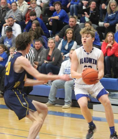 Gladwin’s Dalton Peters attempts to evade a Shepherd defender.