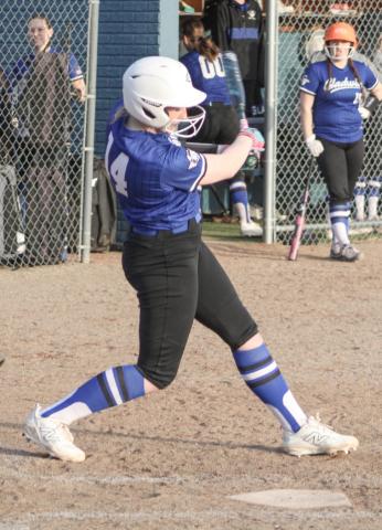 Gladwin’s Elizabeth Mickler takes a cut during Thursday’s season-opening doubleheader against visiting Hemlock.