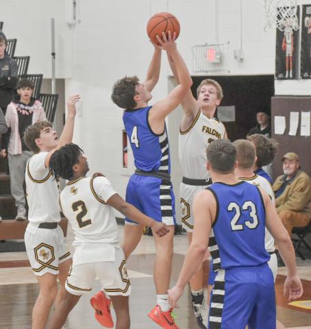 Ben Verellen takes it to the rim during Thursday night’s 64-60 victory at Ogemaw Heights, the 14th win in a row for the Flying G’s. PHOTO BY BETH ORR