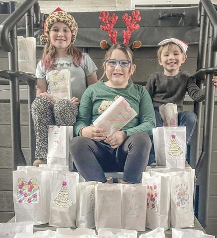Pictured are Caroline, Logan, and Lily, the spirited children of Tyler and Angela McLaren. They are also the cherished grandchildren of Tina and Mike Haines, Kim and Pat Savage, and Mark and Amy Baker, all proud residents of Beaverton.
