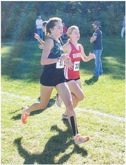 Tessa Wohlschlegel running at the Dwayne Rau Memorial Invitational. PHOTO PROVIDED BY PHIL EICHBAUER.