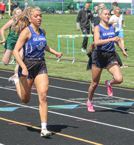 Gladwin’s Kamya Cajigas races to a school record in the 200 meters Saturday at the Jack Pine Conference Meet Saturday, just ahead of previous recordholder Breanna Campbell.