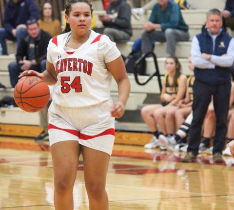 Leiyah Mungin dribbles the ball down the court while scanning for open teammates.
