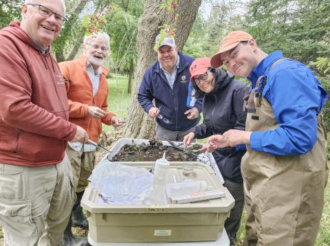 Volunteers at a stream sampling station. GLADWIN
