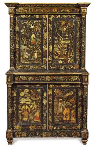 Repainting old furniture is not new. This cabinet was made around 1830, but the elaborate decorations were added later. KOVELS.COM