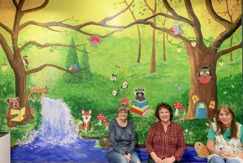 MAGICAL FOREST MURAL GREETS LIBRARY PATRONS