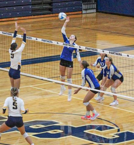 Gladwin’s Ansley Mausolf rises up to spike the ball during a recent match. The Flying G’s beat Bullock Creek last Wednesday.
