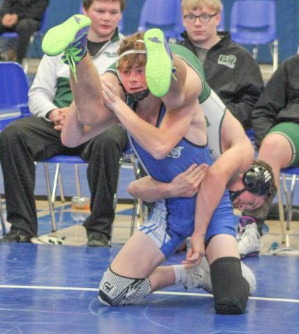 Gladwin’s Ethan Palmateer gives a Pine River opponent a lift during a match at Saturday’s team tournament.