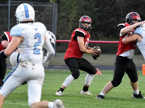 Beaverton quarterback Landon Love drops back to pass during Friday night’s Homecoming battle.