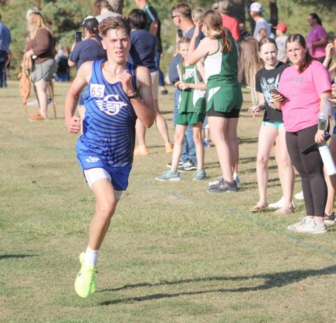 Gladwin’s Ben Verellen fights his way to a third-place finish at last week’s Jack Pine Conference jamboree at Pine River Golf Club in Standish. He went on to run second at an invitational Saturday.