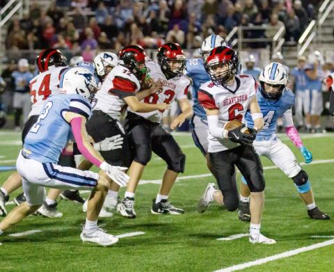 Beaverton’s Mason Barth looks for some hard-to-find running room during Friday night’s loss at undefeated Meridian. JESSICA KELLER