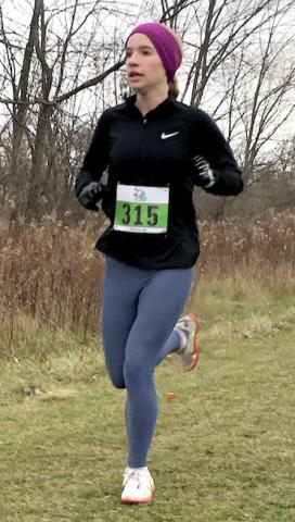 Wohlschlegel running in the Girls All Comers Open Race.