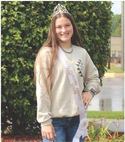 Taylor Bonham wearing her crown and sash she acquired for winning the Queens Contest at the Midland County Fair.