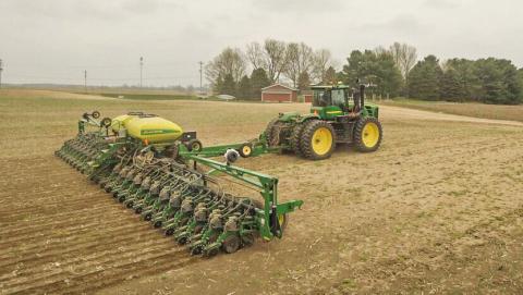A farmer operates a soybean planter in early spring. KINGIMAGING VIA PIXABAY