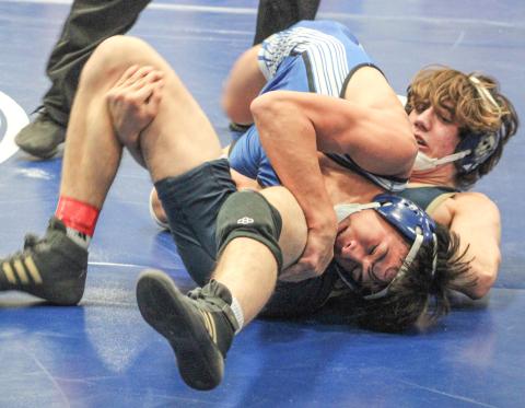 Gladwin’s Cruz Balcirak goes for a pin during a match earlier this year. Balcirak won the Jack Pine Conference championship at 126 Saturday.