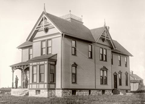 Isaac Hanna home located on Cemetery Road, note the headstones in the background at left.