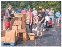 Volunteers sorting and assisting food into cars at Christ the King.